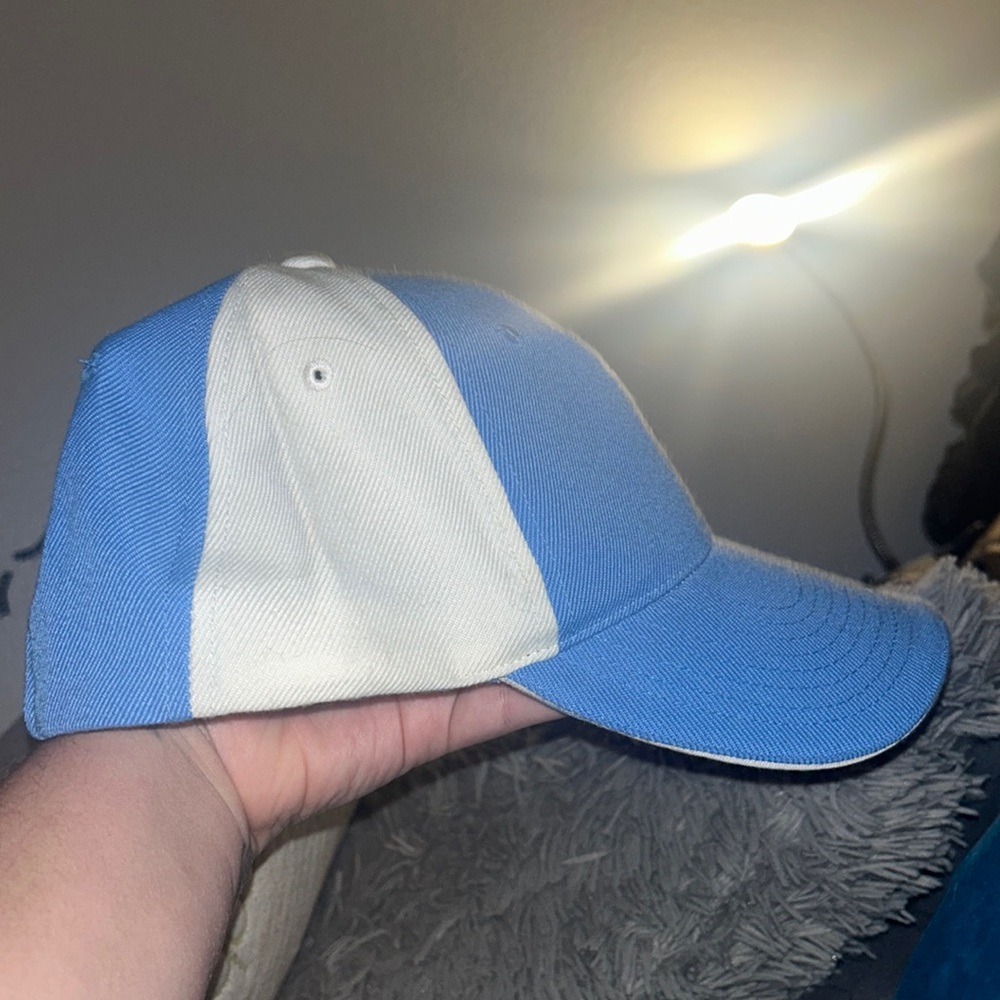 blue and whit baseball hat
